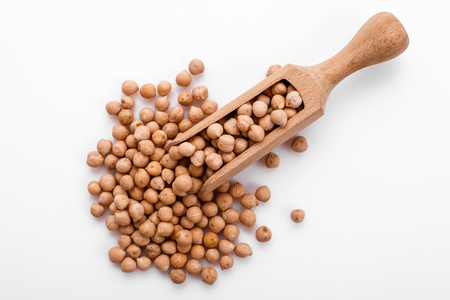 uncooked chickpeas on a white acrylic background.の写真素材