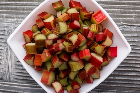 fresh rhubarb on a wooden rustic background.