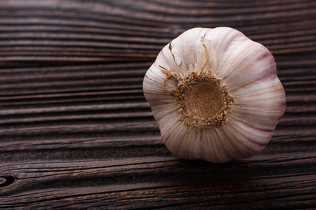 fragrant garlic on a wooden rustic background.の写真素材