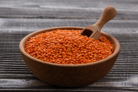 raw lentils on a wooden rustic background.の写真素材