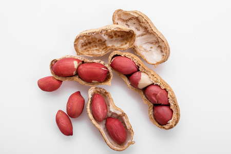fresh peanuts on a white acrylic background.の写真素材
