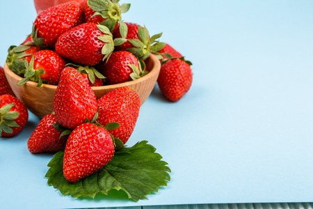 juicy fresh strawberry on a delicately blue background.の写真素材