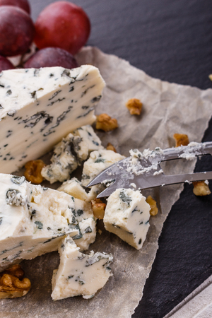 delicious blue cheese on wooden rustic background.の写真素材