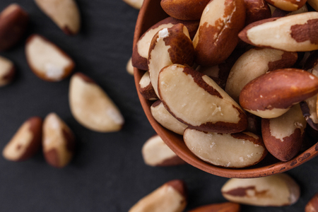 brazil nut on a dark stone background.の写真素材