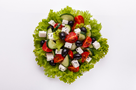 Greek salad on a white acrylic background.の写真素材