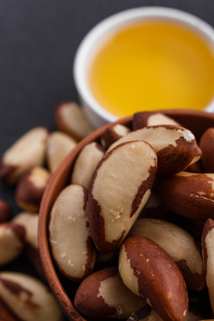 brazil nut on a dark stone background.の写真素材