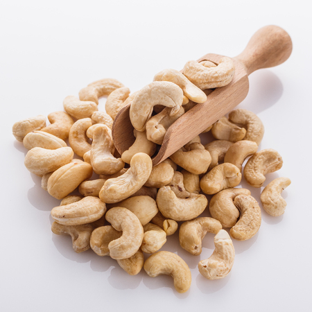 cashew nuts on a white acrylic background.の写真素材