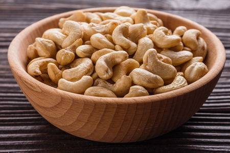 cashew nuts on a rustic wooden background.の写真素材