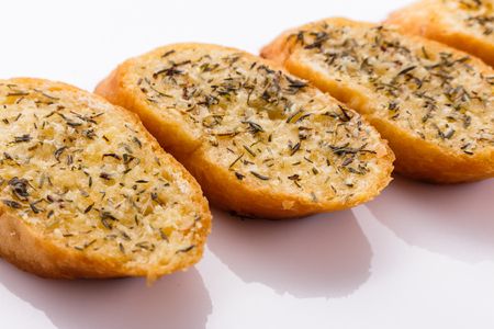 fragrant garlic bread on a white acrylic background.の写真素材