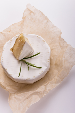 delicious creamy camembert cheese on a white background.の写真素材