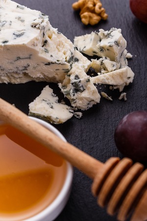 delicious blue cheese on wooden rustic background.の写真素材