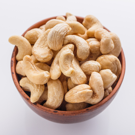 cashew nuts on a white acrylic background.の写真素材