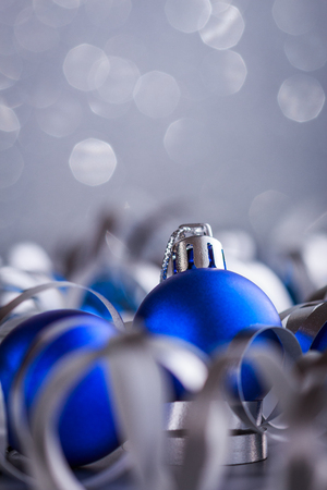 Christmas composition of Christmas tree toys on a blurred silver backgroundの写真素材
