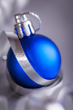 Christmas composition of Christmas tree toys on a blurred silver background.の写真素材