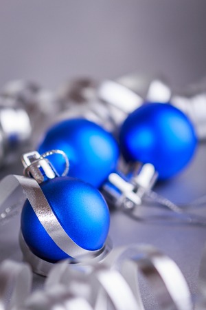 Christmas composition of Christmas tree toys on a blurred silver background.の写真素材