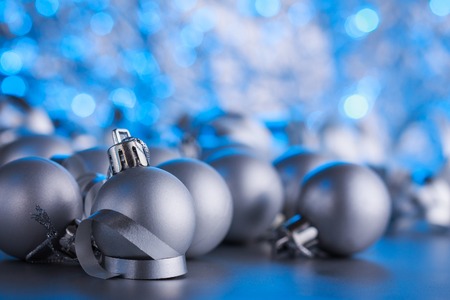 Christmas composition of Christmas tree toys on a blurred silver background.の写真素材