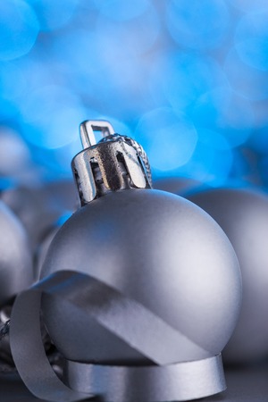 Christmas composition of Christmas tree toys on a blurred silver background.の写真素材