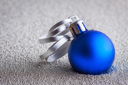 Christmas composition of Christmas tree toys on a blurred silver background.の写真素材