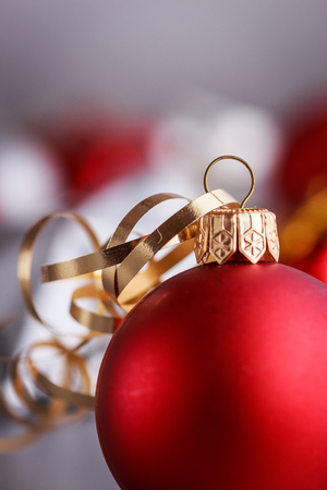 Christmas composition of Christmas tree toys on a blurred silver background.の写真素材
