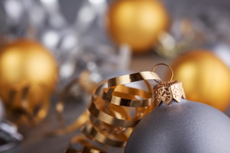 Christmas composition of Christmas tree toys on a blurred silver background.の写真素材