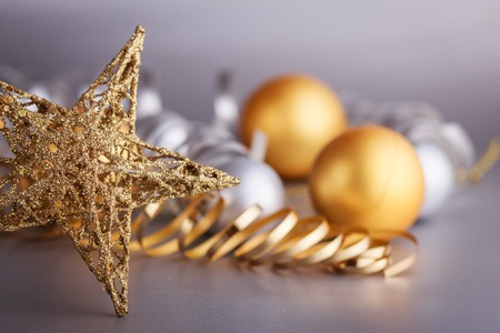 Christmas composition of Christmas tree toys on a blurred silver background.の写真素材