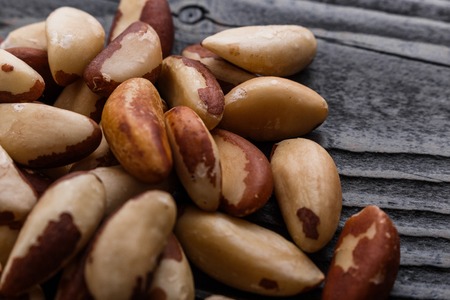 brazil nut on a dark rustic wooden background.の写真素材