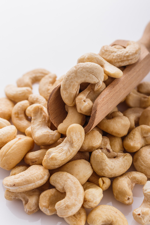 cashew nuts on a white acrylic background.の写真素材
