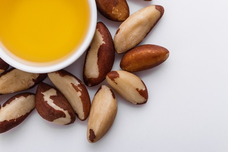 brazil nut on a white acrylic background.の写真素材