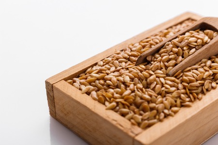 Seeds of golden flax on a white background.の写真素材