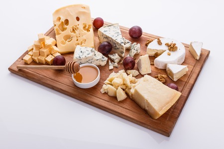 set of different cheeses on a wooden rustic background.の写真素材
