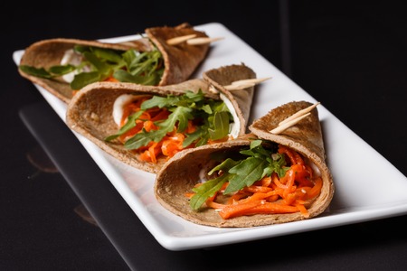 liver pancakes rolls on a dark background.の写真素材