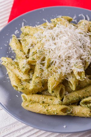 pasta pesto on a white wooden background.の写真素材