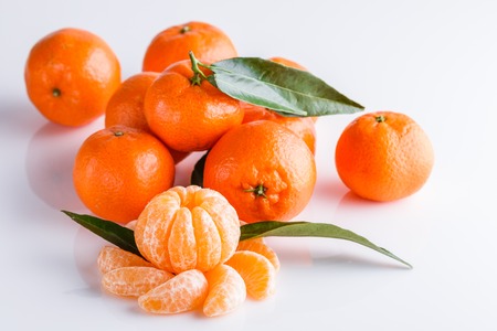 juicy mandarin on a white acrylic background.の写真素材