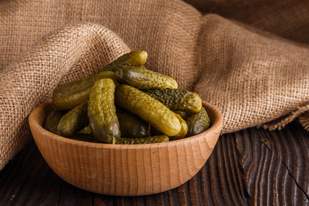pickled vegetables on a wooden rustic background.の写真素材