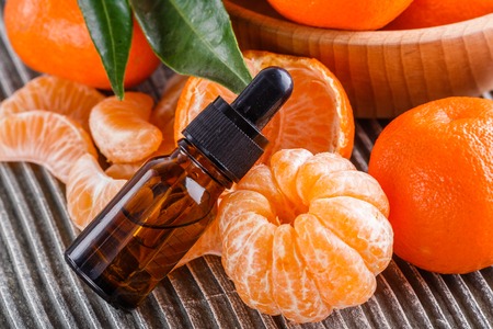 juicy mandarin on a gray wooden rustic background.の写真素材