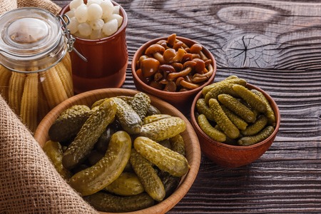 pickled vegetables on a wooden rustic background.の写真素材