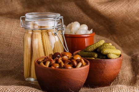pickled vegetables on a wooden rustic background.の写真素材