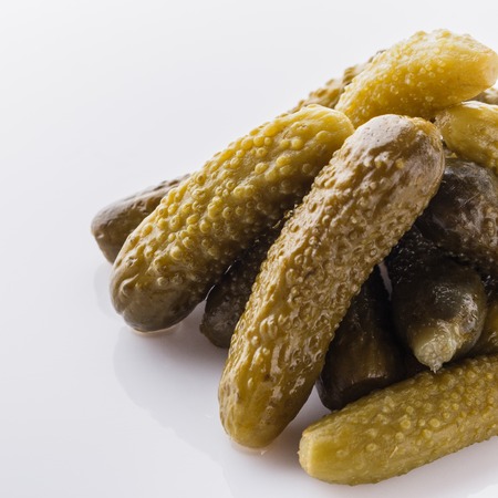 pickled vegetables on a white acrylic background.の写真素材