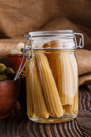 pickled vegetables on a wooden rustic background.の写真素材