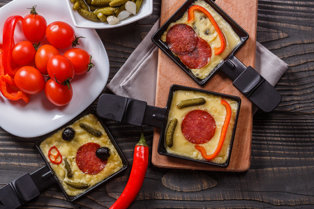 Preparing a traditional Swiss cheese raclette.の写真素材