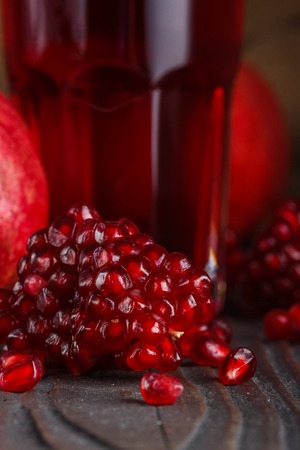 grains of a grenade on a dark rustic background.の写真素材