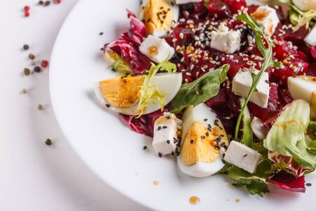Fresh mixed salad in a bowl on a white background.の写真素材