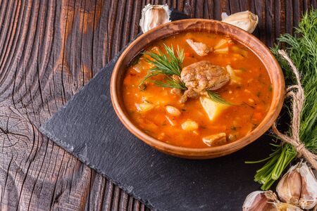 Chanahi a traditional Georgian meat stew in a bowl on stony board.の写真素材