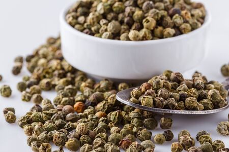 green peppers in bowl on white background.の写真素材