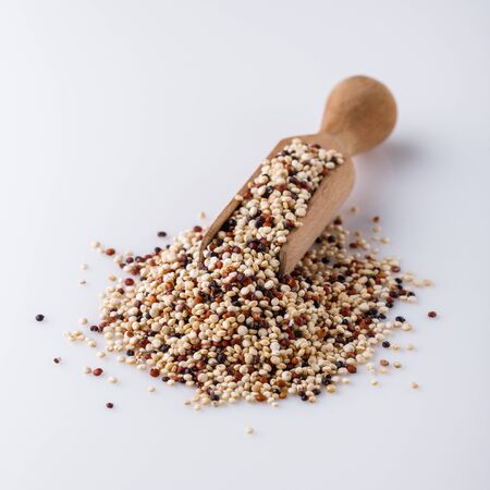 mix of quinoa grains on white acrylic background.の写真素材