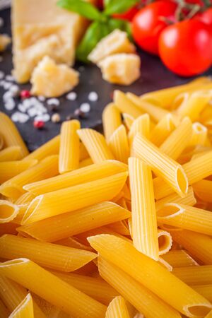 concept of traditional italian pasta with tomatoes and basil.の写真素材
