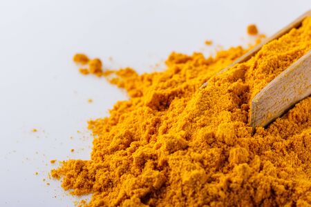 natural turmeric powder on white acrylic background.の写真素材
