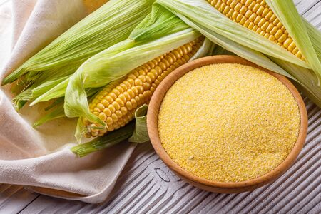 Polenta corn porridge on white wooden rustic background.の写真素材