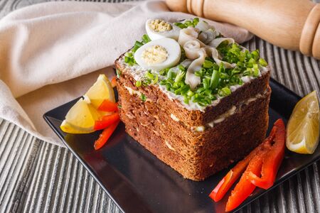 a huge herring sandwich with mayonnaise and quail eggs.