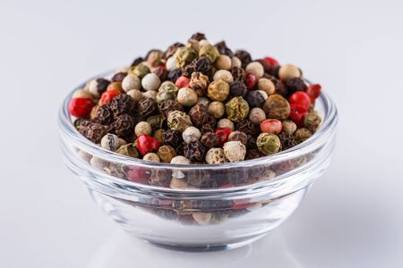 mix of peppercorns on white acrylic background.の写真素材